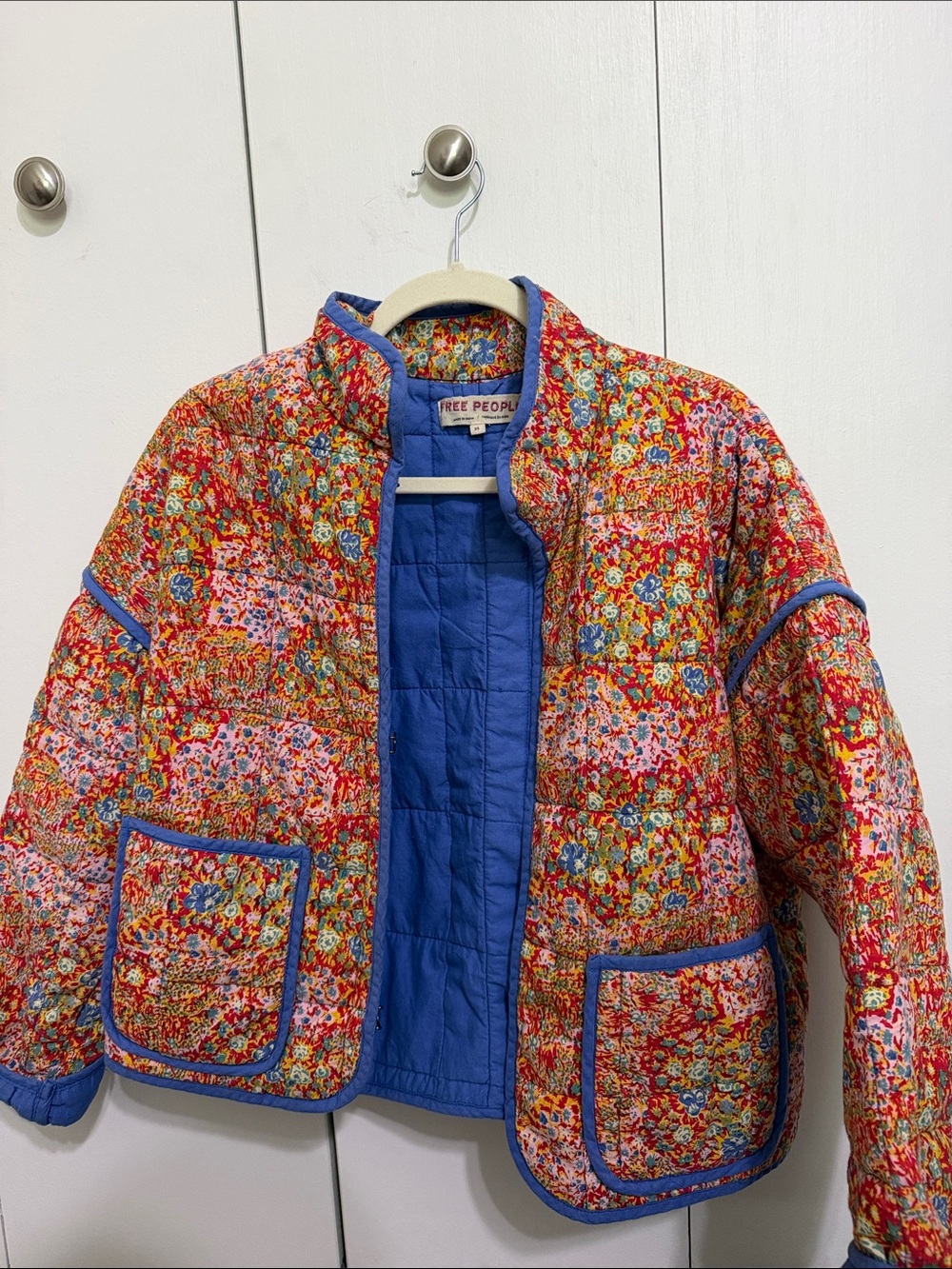 Free People Quilted Floral Puffer Jacket in Orange with Blue Trim